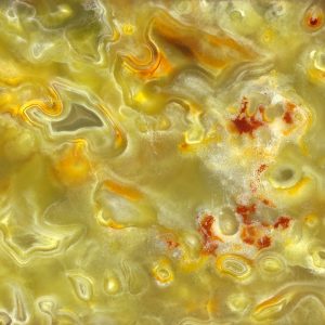 Magnified image details of a layer of onyx green yellow and orange